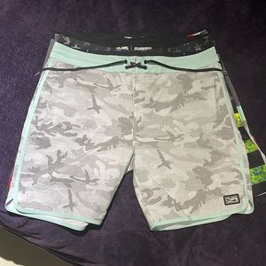 Pelagic board shorts.